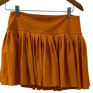 Aerie Offline orange tennis skirt with pleats with short. 14”